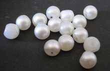 Glasknoop-parel 6  x 7 mm